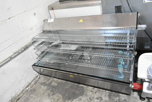 Brand new ServIt 423HDM48SA 48" heated display case with three shelves, sliding doors, and broken glass. 120V, 1 phase.