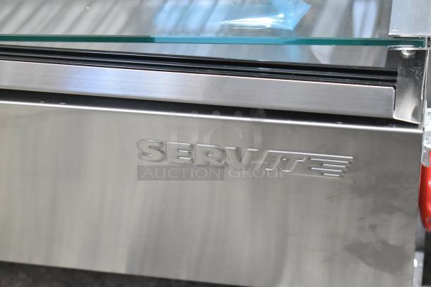 Brand new ServIt 423HDM48SA 48" heated display case, stainless steel, scratch and dent condition, broken glass visible.