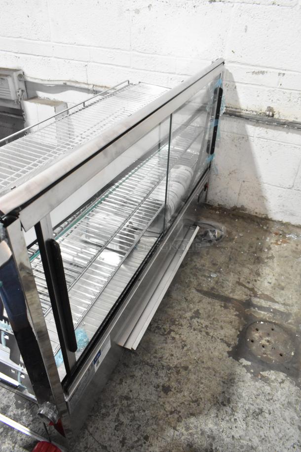 BRAND NEW SCRATCH AND DENT! ServIt 423HDM48SA 48" heated display case, three shelves, sliding doors, broken glass. 120V, 1 Phase.