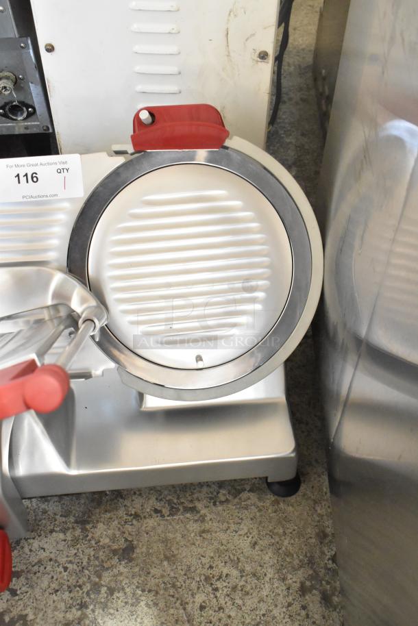 Berkel B12-SLC metal meat slicer, 12", scratch and dent, with blade sharpener. Model with visible auction tag, mint condition.