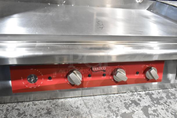Brand new Avantco 177EG48N stainless steel 48" electric griddle, 208/240 volts, 1 phase, with control knobs and slight scratches.