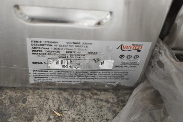 Avantco 177EG48N stainless steel 48" electric griddle, scratch and dent, 208/240 volts, 1 phase, label showing specs.