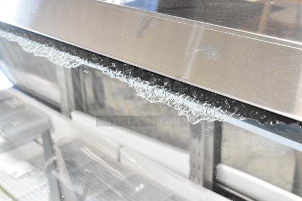 Alt Text: Avantco 178DLC82HCW deli case with damaged curved glass panel, showing visible cracks; 115V, 1 phase.