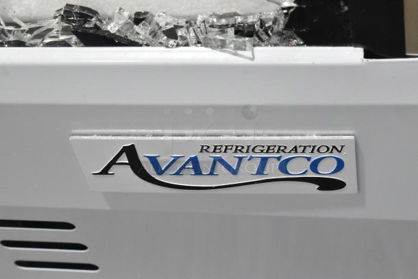 BRAND NEW Avantco 178DLC82HCW 82" white refrigerated deli case with curved glass, 115V, 1 Phase. Glass damage visible.