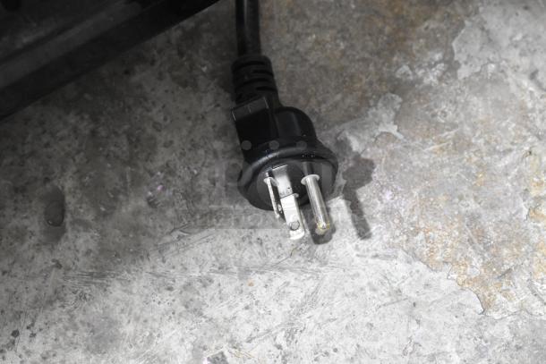 Close-up of the power plug for a 2023 Crathco FROSTY3NEW stainless steel commercial slushie machine, 115 volts.