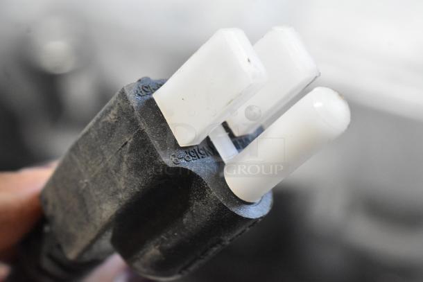 Close-up of a power plug for the Hobart Ecoline EMM10 dough mixer. Plug shows light dust, indicating new but exposed condition.