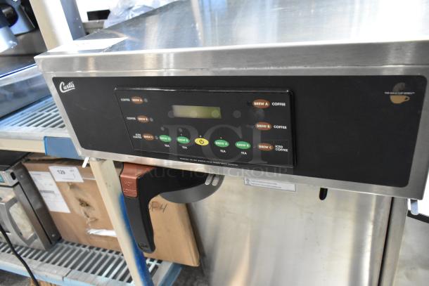 Curtis CBHT stainless steel commercial coffee/tea brewer. New, minor scratches. 220V, 1 Phase. Poly brew basket included.
