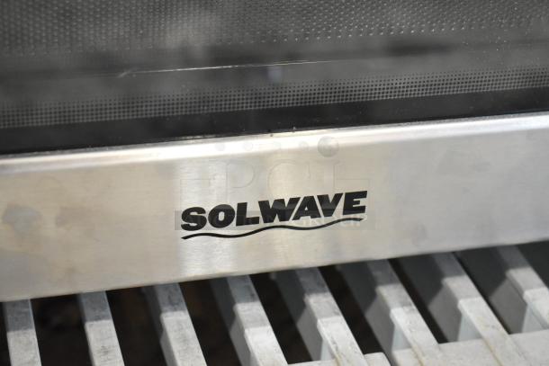 BRAND NEW Solwave Stainless Steel Commercial Microwave Oven, countertop model, visible logo, minor scratches.