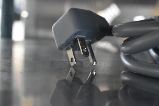 Close-up of a power plug for a Solwave stainless steel commercial countertop microwave oven, brand new scratch and dent condition.