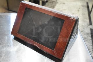 Box of Menu Solutions wooden countertop menu holders, brand new, scratch and dent condition, wrapped in plastic.