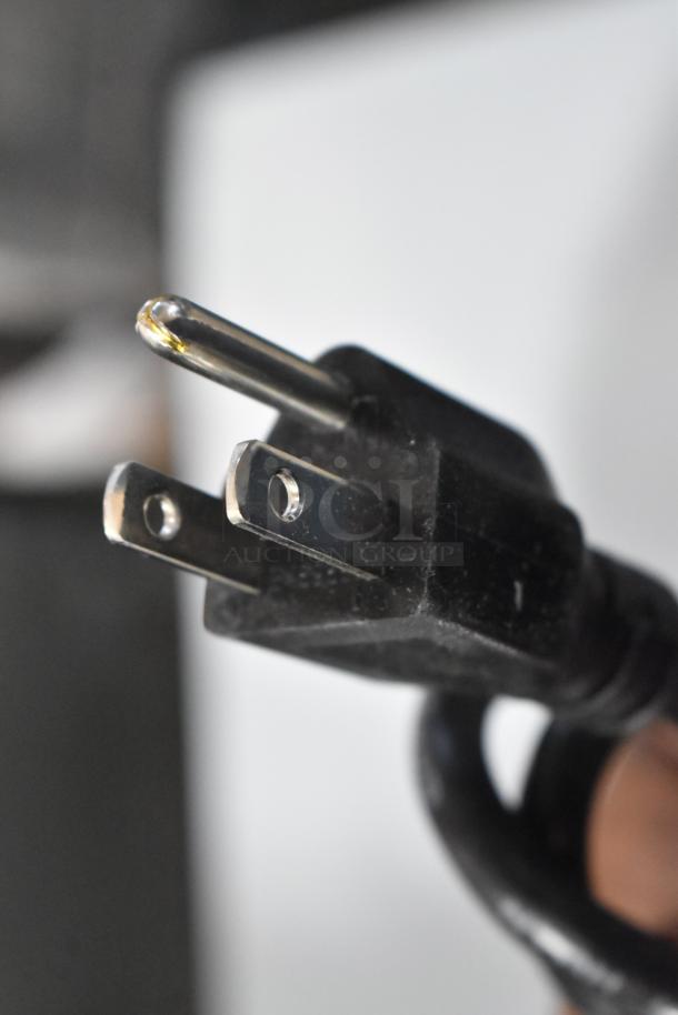 Close-up of a power plug for RiceMaster 56919 rice warmer. Brand new, scratch and dent condition, 92 cup capacity, stainless steel.