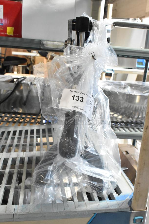 BRAND NEW Garde 5015567 metal citrus juicer, scratch and dent, in packaging on shelf, auction tag visible.