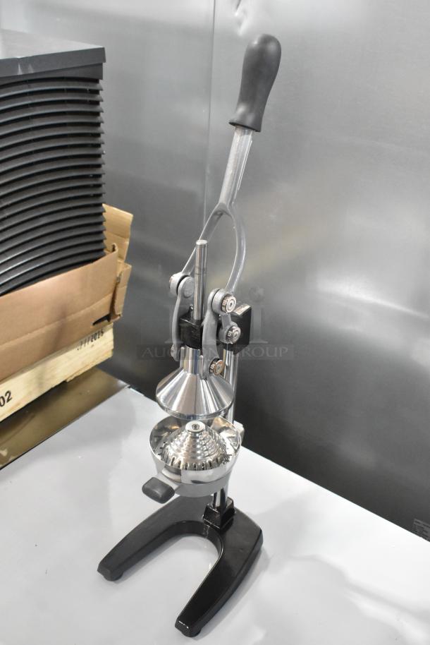 Brand new Garde 5015567 metal countertop manual citrus juicer, scratch and dent condition. Silver finish, sturdy base.