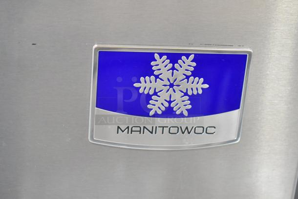 Manitowoc logo on stainless steel, featuring a snowflake emblem. Model IYT0450A-161 label visible.