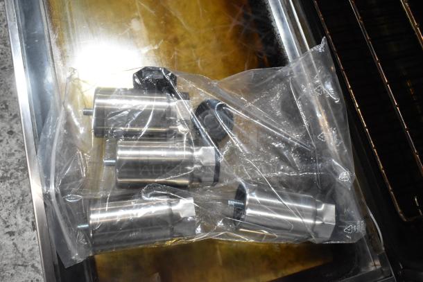 Cooking Performance Group convection oven accessories in sealed bag, stainless steel parts visible.