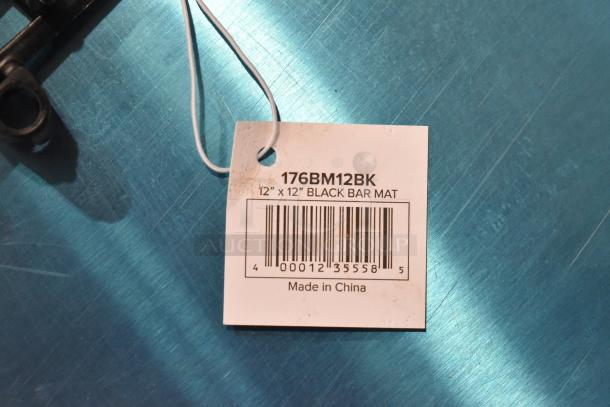 Two brand new Choice 176BM12BK 12" x 12" black interlocking bar mats, scratch and dent, barcode and tag shown.