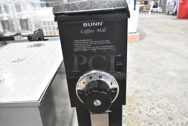 BRAND NEW scratch and dent 2025 Bunn G3 HD commercial coffee grinder, black, 3 lb. capacity, 120V, countertop model, user instructions on front.