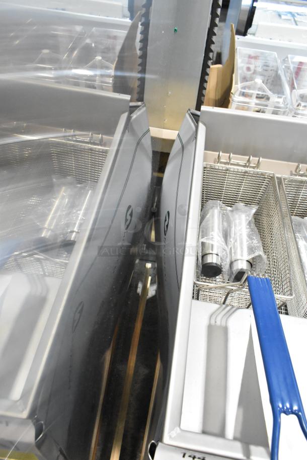 Brand new Imperial IFS-40-E 40 lb. stainless steel electric deep fryer with two metal baskets, scratch and dent condition.