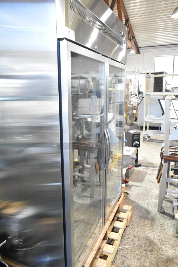 Brand new Avantco 178Z2RGHC stainless steel commercial 2-door reach-in cooler on pallet, features poly coated racks.