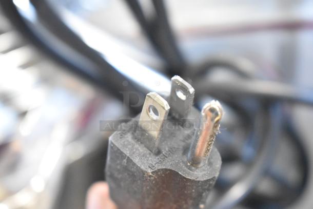 Close-up of the power plug for an Estella 348EMIX12G commercial 12 Qt. mixer, showing a three-prong design.