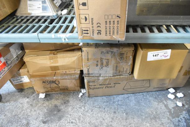 Boxes of new scratch and dent items including Acopa bowls and stemless wine glasses, labels detailing dimensions and quantity.