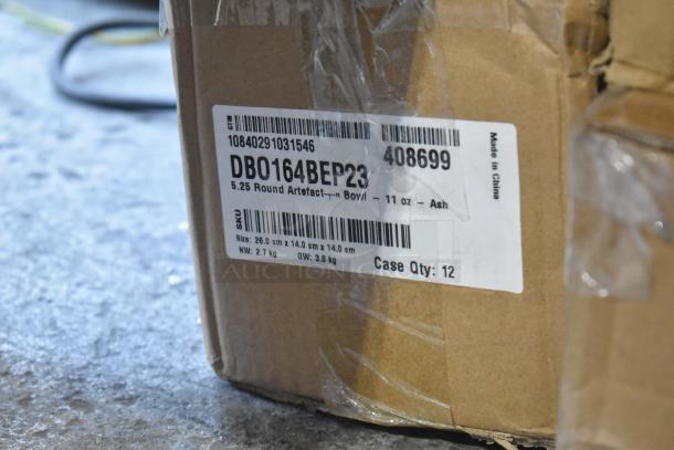 Cardboard box with label showing SKU DB0164BEP23 for 12 Front of the House 11 oz. Ash Round Porcelain Bowls.