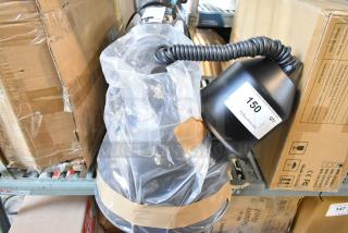 Brand new scratch and dent warming lamp, coiled cord, plastic covering, item marked 150 QTY, visible in warehouse setting.