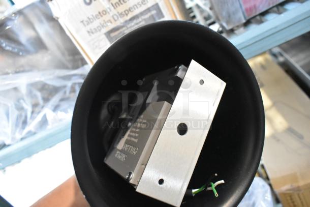 Brand new scratch and dent warming lamp, black finish, with visible wiring and metal bracket, slight imperfections.