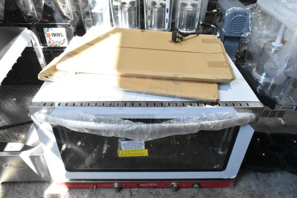 Brand new Avantco stainless steel countertop convection oven with glass damage, still in packaging, some dents visible.