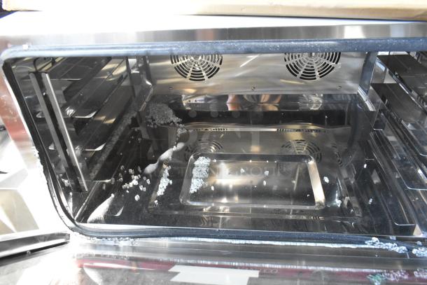 Brand new Avantco stainless steel commercial countertop convection oven, scratch and dent, with visible glass damage.