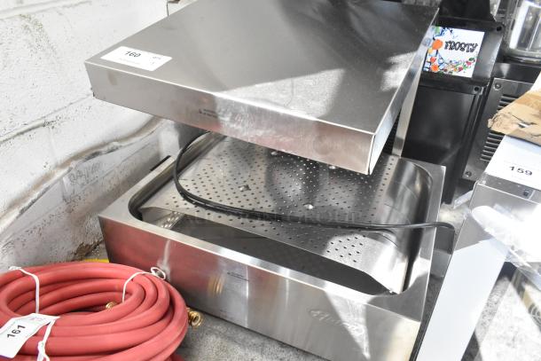Brand new Hatco GRFHS-PT26 stainless steel fry holding station, 29" pass-through, 120V, 1 phase, with minor scratches.