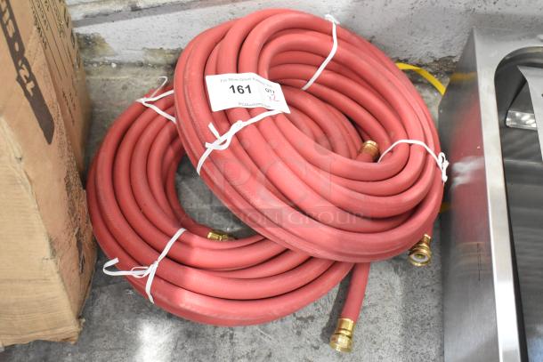2 new red hoses with brass fittings, tagged "161 QTY 2." Slight scratches, ideal for bulk purchase.