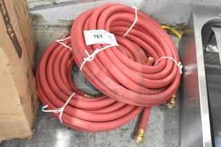 2 new red hoses with brass fittings, tagged "161 QTY 2." Slight scratches, ideal for bulk purchase.