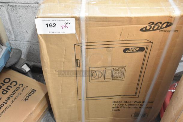 Cardboard box containing a brand-new 360 Office Furniture black steel wall mount 71-key cabinet safe with electronic keypad lock.