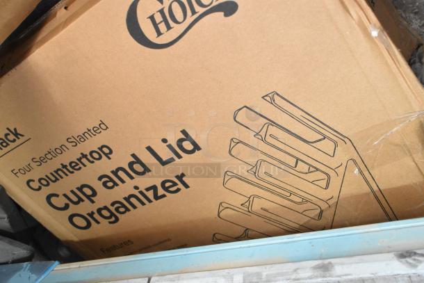 Four-section slanted countertop cup and lid organizer in box, brand new, marked "Choice."