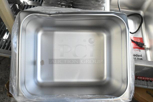 Stainless steel drop-in bin, new condition, minor dents, stack of 20, visible label and power cord included.