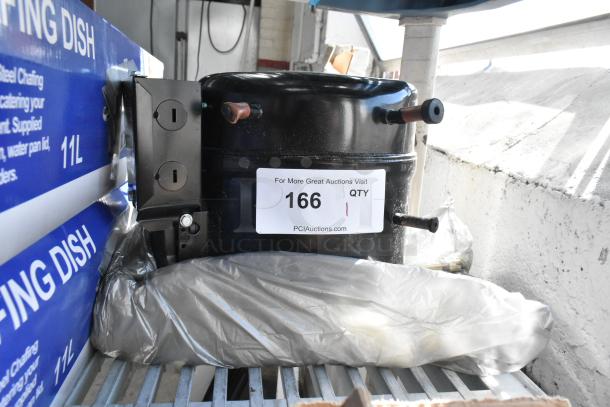 Brand new scratch and dent motor with mounting hardware, shown with a quantity label and PCI Auctions URL.