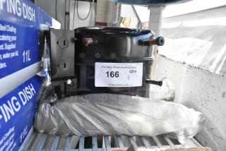 Brand new scratch and dent motor with mounting hardware, shown with a quantity label and PCI Auctions URL.