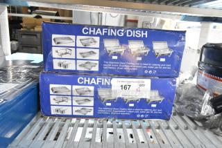 Two brand new chafing dishes in boxes, marked "scratch and dent," each set includes a steam pan, water pan, lid, and fuel holders.