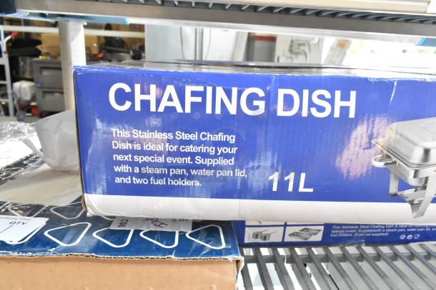 Brand new 11L stainless steel chafing dish in box. Includes steam pan, water pan lid, and two fuel holders. Scratch and dent condition.
