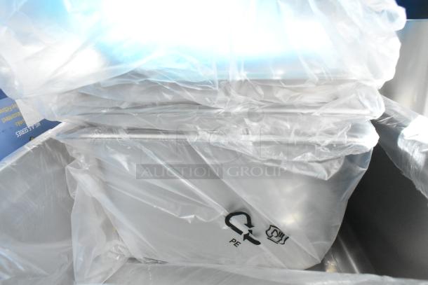 Brand new scratch and dent stainless steel drop-in bins and metal baking pan, wrapped in protective plastic.