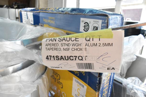 Set of four brand new Choice aluminum sauce pans, including 10 Qt. and 7 Qt., with scratch and dent labels visible.
