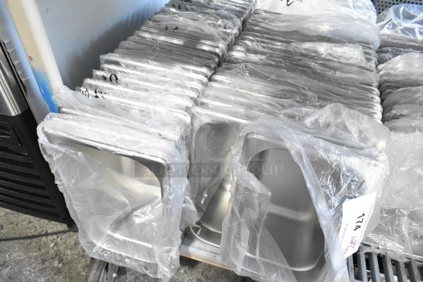75 brand new stainless steel drop-in bins, scratch and dent condition, wrapped in plastic, each bin labeled "174".