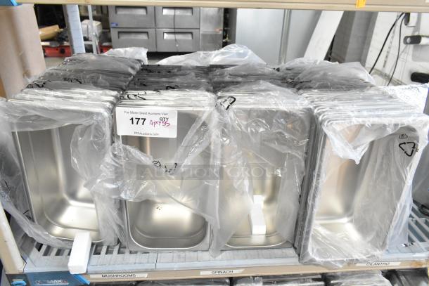 55 brand new scratch and dent stainless steel drop-in bins, wrapped in plastic. Quantity tag "177 QTY 55" visible.