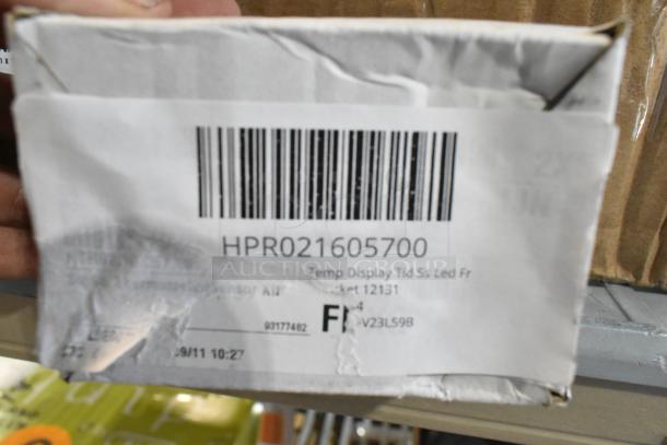 Box with Hatco R02.16.057.00 Temp Display, label shows product code HPR021605700, brand new, scratches visible.