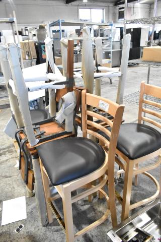 7 brand new bar height chairs, scratch and dent. Mix of wooden and upholstered seats, wrapped for protection.