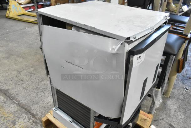 BRAND NEW Scotsman HID525AB-1A Stainless Steel Ice Machine with dents and scratches visible, 25 lb. bin, push button dispensing.