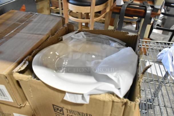Four boxes of brand new Thunder Group white ceramic dishes, scratch and dent condition, partially visible in open packaging.