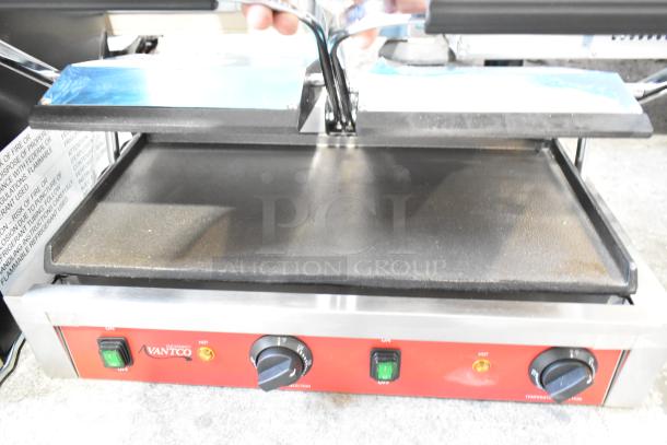 Brand new 2023 Avantco 177PG400S stainless steel dual panini grill with smooth plates, 19 5/8" x 9 1/8" surface, 120V.