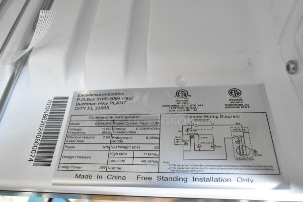 Brand new Excellence EMM-3HC metal black countertop display refrigerator with swing door, 115 volts, 1 phase, scratch and dent condition. Labels show model and specifications.